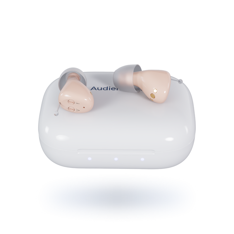 Pair of beige earbuds in a clear plastic case on a white background