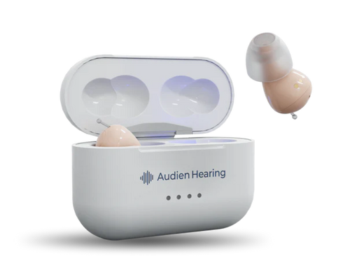 Hearing aid in a white charging case with 'Audien Hearing' branding on a white background
