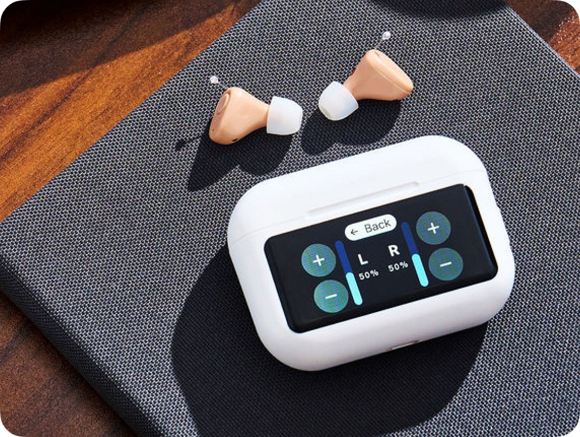 Audien Atom X charging case with the four-mode touchscreen visible